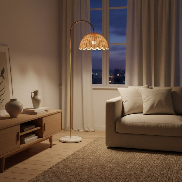 A warm and cozy living room at twilight featuring the Minimalist Boho Natural Rattan Floor Lamp as the primary light source.