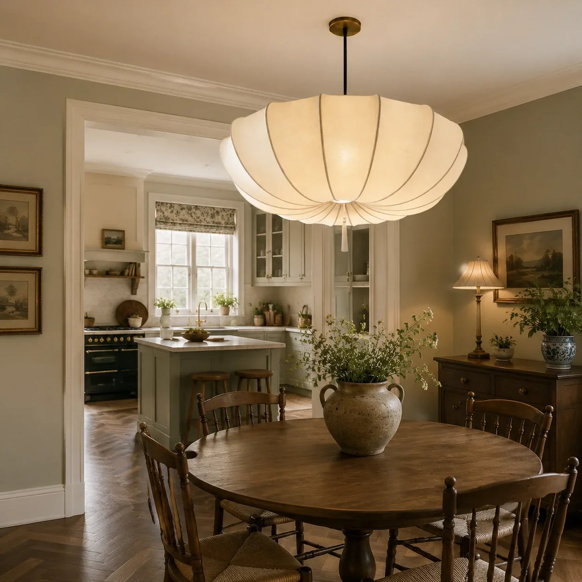 Fabric pendant shade above a kitchen dining area away from the cooking zone