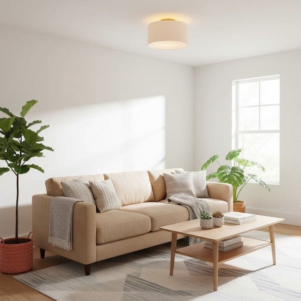 Modern drum flush mount ceiling light with fabric shade installed in a bright living room.