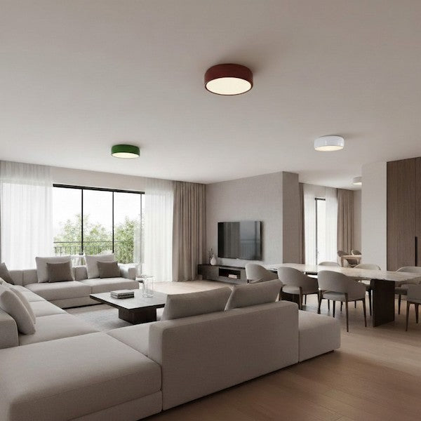 An open-concept modern home with various light sources highlighting different design zones.