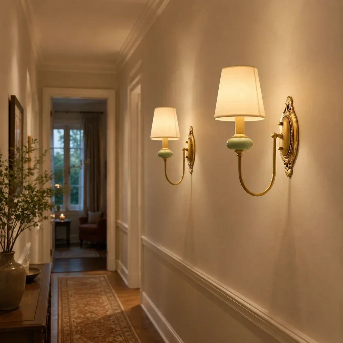 Narrow hallway with shielded wall lights creating an even, low-glare route