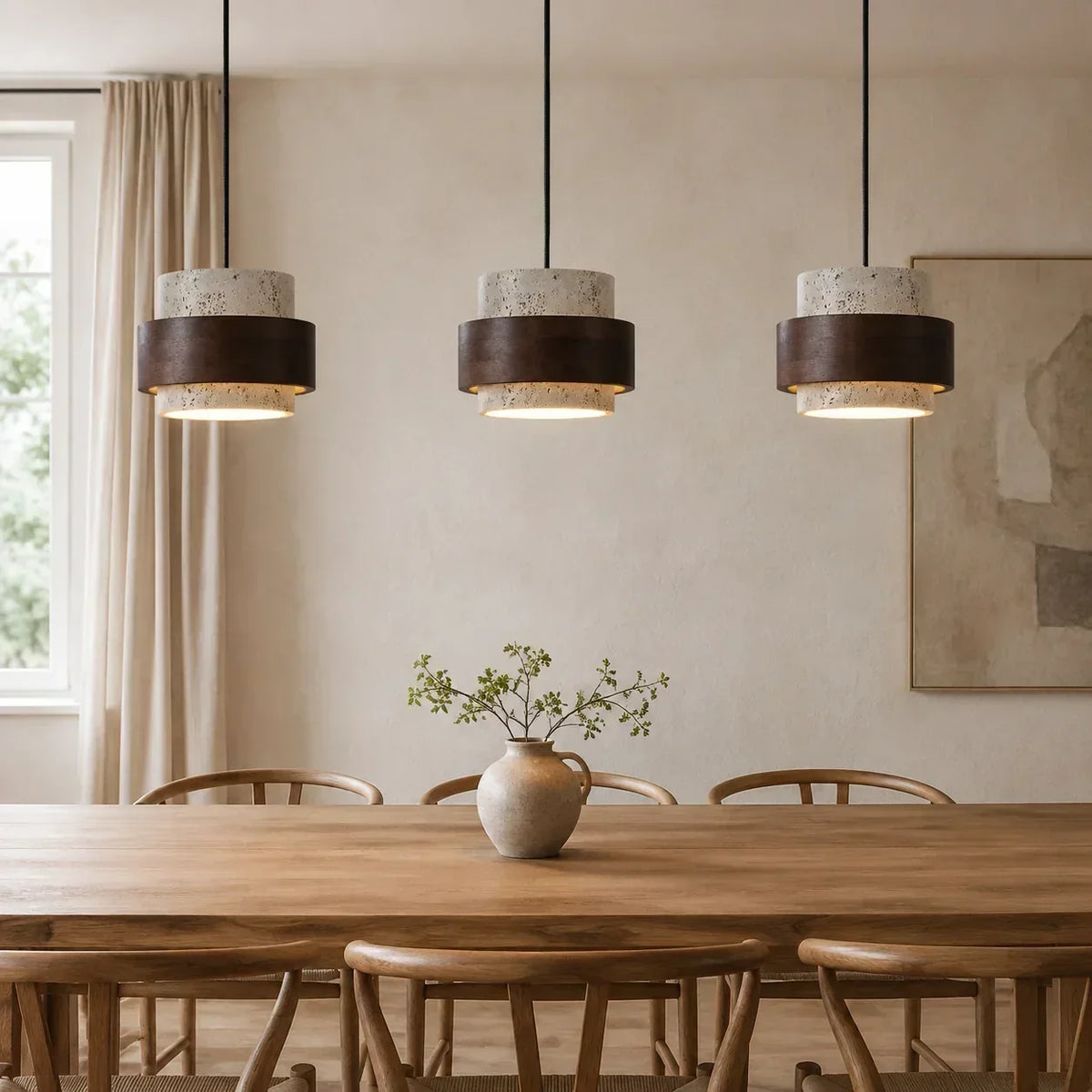 Three wood and travertine pendant lights above a dining table