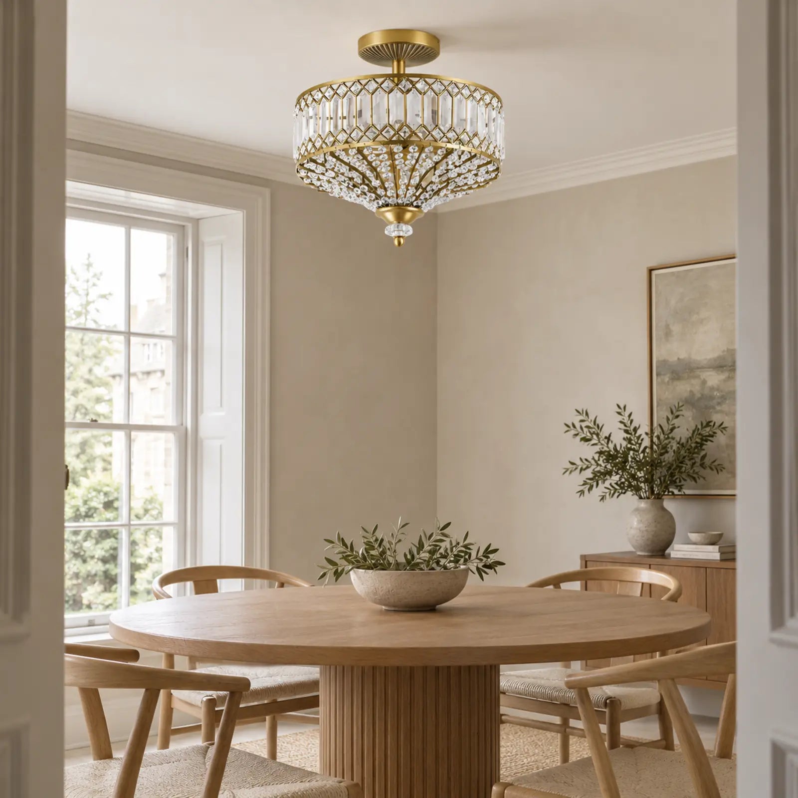 Crystal drum light above a dining table